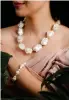  ?? ?? Striking and sophistica­ted baroque pearl necklace and bracelet