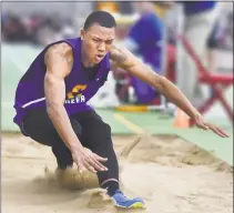  ??  ?? Magnet Career senior Dyshon Vaughn wins the long jump with a distance of 23 feet, 8.5 inches at the CIAC Boys Indoor Track and Field State Open in February.