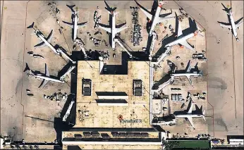  ??  ?? BEWARE: Overhead view shows Terminal 2 at the Fort Lauderdale airport — the scene of Friday’s fatal rampage. Experts warn that baggage claims and ticket counters are terror soft spots.