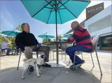  ?? SHERRY LAVARS — MARIN INDEPENDEN­T JOURNAL ?? Steve Ring of Kentfield, left, chats with his friend David Riedel of Greenbrae outside Peet's Coffee at Bon Air Center in Greenbrae. The center will celebrate its 70th year with a party May 7.