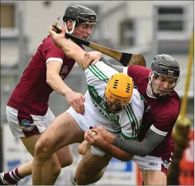  ??  ?? Colin Fennelly beats the O’Connor cousins, Patrick and Joe, to the ball.