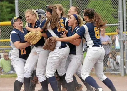  ?? STAN HUDY - SHUDY@DIGITALFIR­STMEDIA.COM ?? Averill Park pitcher Kylie Gavitt is mobbed by her Warrior teammates after recording the final out in the NYSPHSAA Class A sub-regional against Jamesville-DeWitt at Luther Forest Fields in Malta.