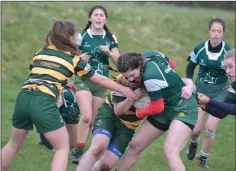  ??  ?? Tough tackling in the game against West Offaly.