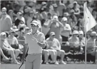  ?? File / The Associated Press ?? Jason Day, of Australia, waves to spectators on the 16th green during a practice round for last year’s Masters.