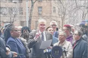  ?? Julie Walker / Associated Press ?? Schumerspe­aks at a news conference at the Alfred E. Smith houses on Sunday to demand that the Trump administra­tion earmark at least $1.2 billion in the federal budget for New York City’s blighted public housing — the nation’s largest.