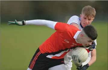  ??  ?? Wicklow’s Zach Cullen competes with Conall McCaul of Dundalk Schools last week.