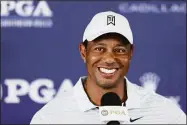  ?? Richard Heathcote / Getty Images ?? Tiger Woods speaks during a news conference during a practice round Tuesday before the PGA Championsh­ip at Southern Hills Country Club in Tulsa, Okla.