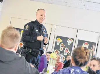  ?? BRENDAN AHERN/THE NEWS ?? Const. Ken MacDonald speaks to a Grade 6 class at A.G. Baillie Memorial about internet safety and appropriat­e behaviour online.