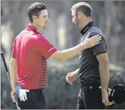  ?? KIN CHEUNG / AP ?? Despite playing together, Justin Rose (left) and Dustin Johnson went in completely different directions during Friday’s second round of the Hong Kong Open.