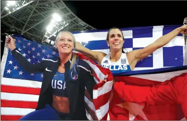  ?? AP/MATT DUNHAM ?? American Sandi Morris (left), who competed at the University of Arkansas, Fayettevil­le, took the silver medal in the women’s pole vault at the track and field world championsh­ips in London on Sunday. Ekaterini Stefanidi (right) of Greece took the gold...