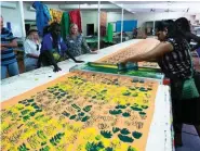  ??  ?? Jess Gunjul Phillips (above, at left), Raylene Bonson and Lucy Yarawanga screen-print an ancestral design, Kun-ngol (clouds), by Elizabeth Kandabuma, at the Bábbarra Women’s Centre. Guide Phil May (right) unravels his knowledge of the Arafura Swamp.