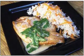  ?? Tribune News Service/LINDA GASSENHEIM­ER ?? Thai Tilapia With Peanut-Coconut Sauce and Basmati Rice