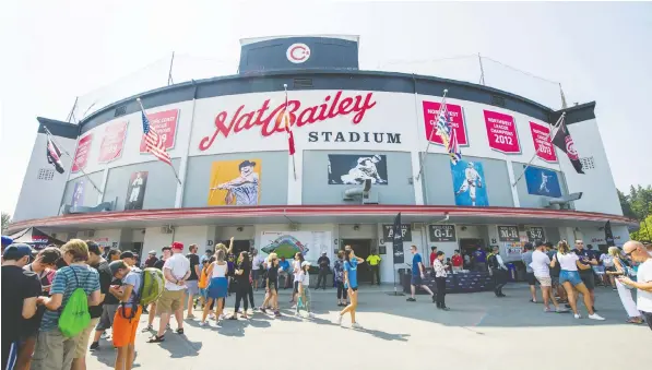  ?? —ARLEN REDEKOP PNG FILES ?? People stand outside Nat Bailey Stadium before a Vancouver Canadians baseball game. City auditors have complained about what they call ‘noncomplia­nce issues’ and ‘deficienci­es’ in areas including maintenanc­e and a lack of oversight at the city-owned facility.