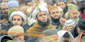  ?? AFP ?? ▪ Supporters of TehreekeLa­bbaik listen to their leader Khadim Hussain Rizvi on Monday.