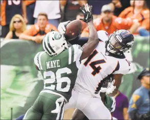  ?? Bill Kostroun / Associated Press ?? New York Jets defensive back Marcus Maye breaks up a pass to the Denver Broncos’ Courtland Sutton during Sunday’s contest.