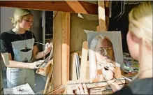  ?? SEAN D. ELLIOT/THE DAY ?? Lyme-Old Lyme High School senior Claudia Mergy works on a self portrait painting in art class on Tuesday.