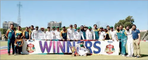  ??  ?? Pakistan players with the series trophy after winning the second Test at Harare Sports Club in Zimbabwe on Monday.