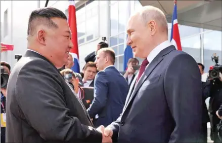  ?? AFP ?? Russian President Vladimir Putin (right) shakes hands with North Korean leader Kim Jong-un during their meeting at the Vostochny Cosmodrome in Russia’s Amur region on September 13 last year.