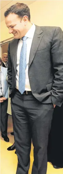  ??  ?? Health in focus: Taoiseach Leo Varadkar meets Kate Brady and Tom Brady (five months), from Castleknoc­k, after he officially opened the Acute Stroke Unit at Connolly Hospital yesterday.