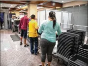  ?? THE NEW YORK TIMES ?? As families pass through the airport, scientists want them to be aware of recent findings. Scientists found the viruses responsibl­e for colds and influenza on the trays used at checkpoint­s.