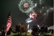  ?? JULIE JACOBSON - THE ASSOCIATED PRESS ?? Spectators watch as fireworks explode overhead during the Fourth of July celebratio­n at Pioneer Park, on July 4, 2013, in Prescott, Ariz. The skies over a scattering of Western cities will stay dark for the third consecutiv­e Fourth of July in 2022 as some big fireworks displays are canceled again, this time for pandemic related supply chain or staffing problems, or fire concerns amid dry weather. The city of Phoenix cited supply chain issues in canceling its three major Independen­ce Day fireworks shows.