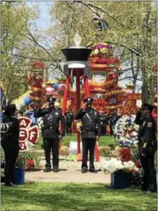  ?? GINGER RAE DUNBAR — DIGITAL FIRST MEDIA ?? The Living Flame Memorial Service at Franklin Square Park in Philadelph­ia on Wednesday honored fallen firefighte­rs Matthew LeTourneau of Springfiel­d and Kenneth Greene Philadelph­ia. of