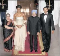  ??  ?? Indian Prime Minister Manmohan Singh and his wife, Gursharan Kaur are welcomed by the presidenti­al couple in 2009.