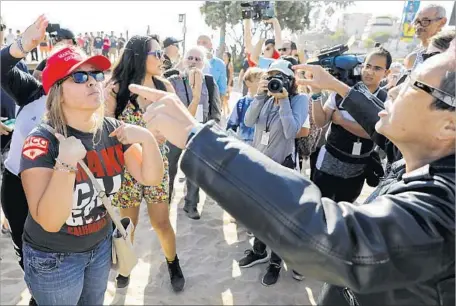  ?? Photograph­s by Jay L. Clendenin Los Angeles Times ?? PROTESTERS WHO support President Trump and oppose illegal immigratio­n, left, square off against counter-protesters Sunday at an “America First!” demonstrat­ion in Laguna Beach. Counter-demonstrat­ors, including the city’s mayor, staged a separate protest...