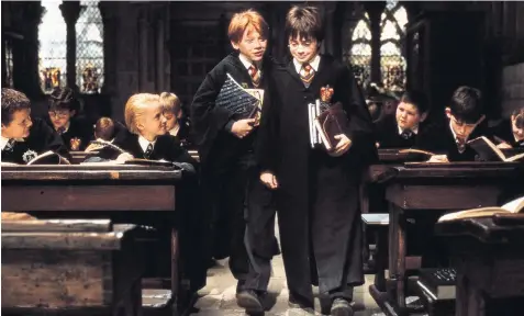  ??  ?? Pupil numbers surged thanks to the Harry Potter films, starring Daniel Radcliffe, Rupert Grint and Emma Watson, left