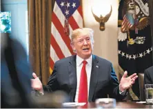  ?? Andrew Harrer / Bloomberg ?? President Trump speaks during a meeting with Republican members of Congress before signing the executive order.