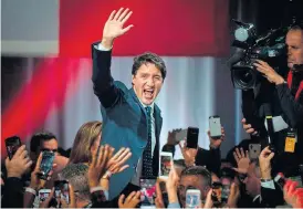  ?? /AFP ?? Congratula­tions: Prime minister Justin Trudeau celebrates his victory with his supporters at the Palais des Congres in Montreal on Monday.