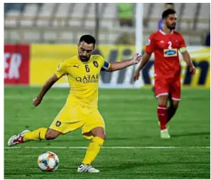  ?? — AFP ?? Goodbye: Al Sadd’s Xavi (left) in action during the AFC Champions League Group D match against Persepolis at the Azadi Stadium in Teheran on Monday.