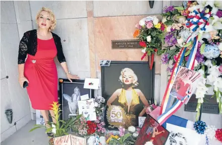  ?? Photos: Reuters ?? A look-alike fan pays her respects at the resting place of Marilyn Monroe at Pierce Brothers Westwood Village Memorial Park Cemetery.