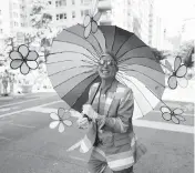  ?? CHARLES SYKES Invision/AP ?? A colorful paradegoer participat­es in the NYC Pride March on Sunday in New York.