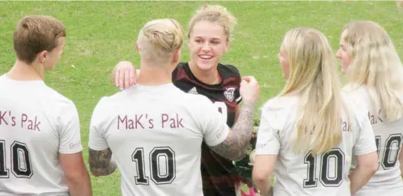  ??  ?? Mississipp­i State senior Makayla Waldner embraces members of her family prior to Sunday’s soccer match against Tennessee. (Photo by Danny P. Smith, SDN)