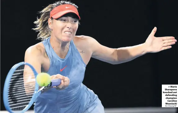  ?? Kin Cheung/AP ?? Maria Sharapova knocked out defending championCa­roline Wozniacki