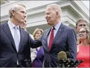  ?? Jacquelyn Martin Associated Press ?? SEN. ROB PORTMAN (R-Ohio) with President Biden, who visited Portman’s home state Wednesday.