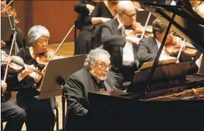  ?? Hiroyuki Ito Getty Images ?? LEON FLEISHER, who died on Aug. 2, shown performing with the New York Philharmon­ic in December 2008. He taught his students about playing music for music’s sake.