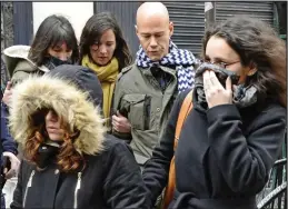  ??  ?? Defiant: Charlie Hebdo staff return to work yesterday