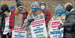  ?? CHRIS CHRISTO / BOSTON HERALD ?? Nurses and their supporters picket outside St. Vincent Hospital in Worcester Feb. 18. A strike is planned for Monday morning, with nurses citing unsafe patient workloads.