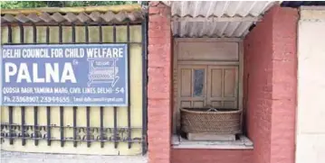  ??  ?? A ‘moses basket’ sits at the entrance to Palna - one of Delhi’s oldest adoption agencies and orphanages caring for some 70 children and registered with the government. Thousands of children are thought orphaned and abandoned in India, although there...