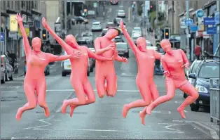  ??  ?? READY: Pink figures take to the streets to highlight the Gibson Street Gala.