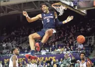  ?? Icon Sportswire via Getty Images ?? UConn forward Isaiah Whaley (5) dunks the ball during a game against East Carolina on Feb. 29 at Williams Arena at Minges Coliseum in Greenville, NC.