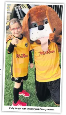  ??  ?? Ruby Halpin with the Newport County mascot