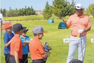  ?? GREG SORBER/JOURNAL ?? Notah Begay III makes some points with young golfers during his charity event Monday at the Santa Ana Golf Course. Begay would like to play a part in finding the state’s next great golfer.