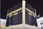  ??  ?? A new kiswa, or covering, is placed atop Islam’s holiest site, the Ka’aba, in Makkah on July 29, 2020. The gold-stitched black covering is changed each year during the Hajj pilgrimage ahead of the Eid al-Adha
celebratio­ns. (Saudi Media Ministry via AP)