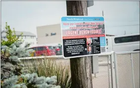  ?? PHOTO FOR THE WASHINGTON POST BY HANNAH YOON ?? Signs posted at beach entrances call on New Jersey Gov. Phil Murphy and the state’s top environmen­tal official to address erosion in North Wildwood.