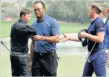  ??  ?? WALKING OFF Woods’ last appearance, a round of 77 in the Dubai Desert Classic in February