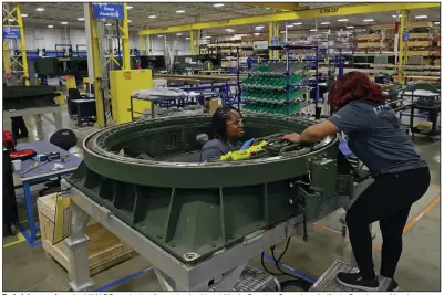  ?? (Arkansas Democrat-Gazette/Colin Murphey) ?? Technician­s work on the HIMARS production line at the Lockheed Martin Camden Operations facility in Camden on Monday.