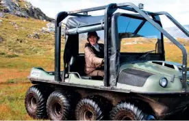  ??  ?? Top: With stalker Charlie Hill from the neighbouri­ng Glenmhor estate. Above: The argocat has made taking stags off the hill easier, allowing Gillian to carry on stalking solo into her eighties.